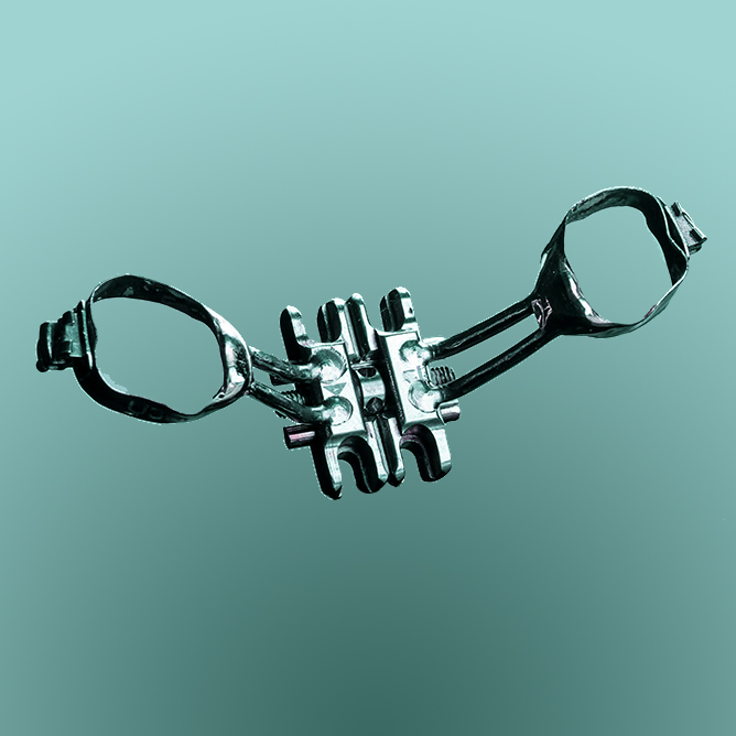miniscrew assisted rapid palatal expander device against a teal background